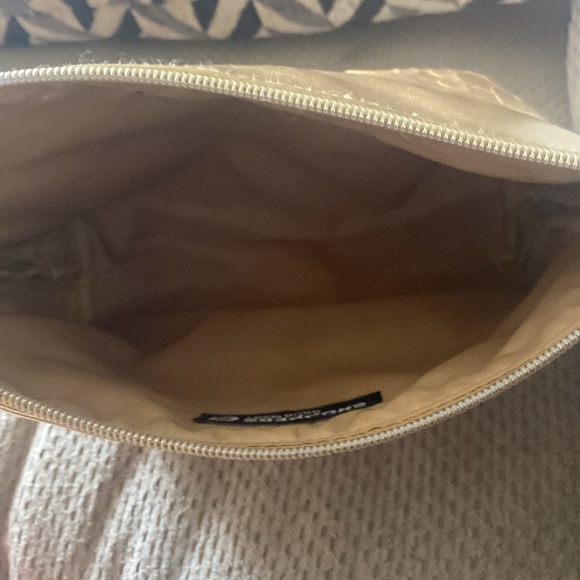 A gold pouch with a zipper slightly used from shoppers drug Mart - Picture 3 of 4